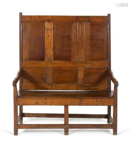 A Jacobean Molded and Paneled Oak Settle