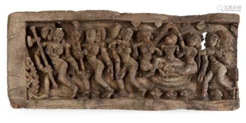 A carved wood panel, India, late 18th century, depicting a series of dancers in movement, wearing