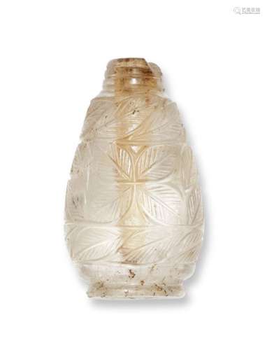 A carved rock crystal perfume bottle, India, early 20th century, with leaf design to body, missing