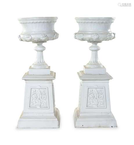 A Pair of Painted Iron Garden Urns