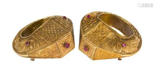 A pair of gilded white sheet metal cuff bracelets, Indonesia, late 19th/early 20th century, of