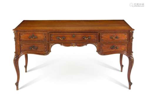 A Louis XV Style Parcel Gilt Oak Bureau Plat