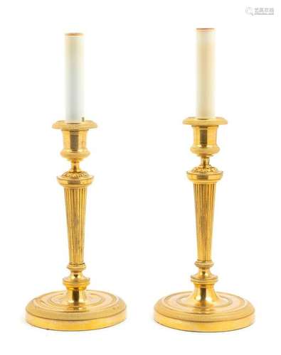 A Pair of Neoclassical Gilt Bronze Candlesticks