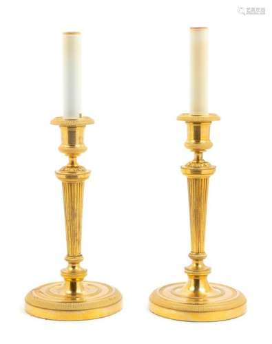 A Pair of Neoclassical Gilt Bronze Candlesticks
