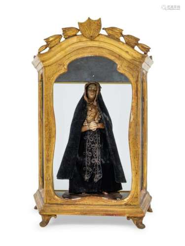 A Continental Giltwood Reliquary with a Painted Figure