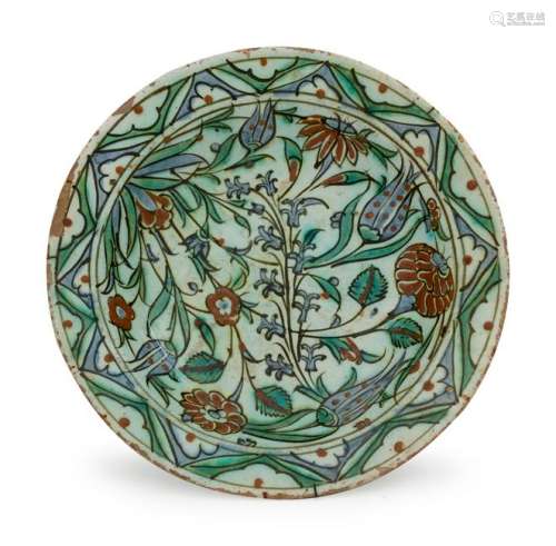 An Iznik Pottery Charger Diameter 11 1/2 inches.