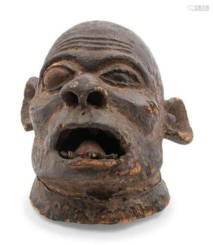 A Makonde Carved Wood Mask Height 14 inches.