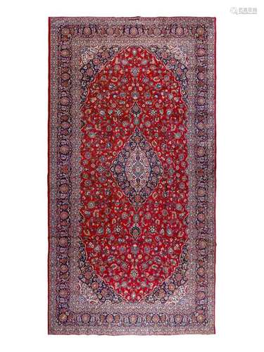 A Kashan Wool Rug 16 feet 2 inches x 9 feet 7 inches.