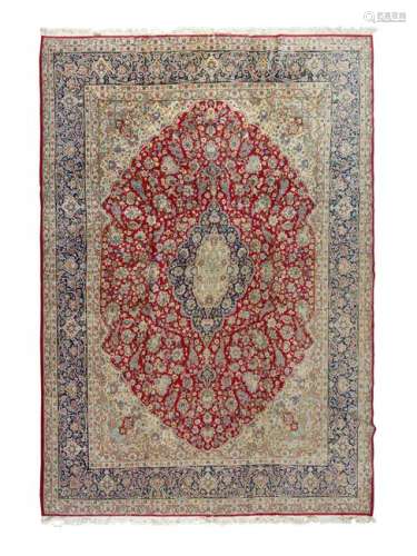 A Kirman Wool Rug 12 feet 11 inches x 9 feet 8 inches.