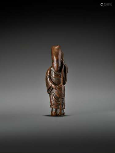 A LARGE EARLY WOOD NETSUKE OF A CHINESE OFFICIAL