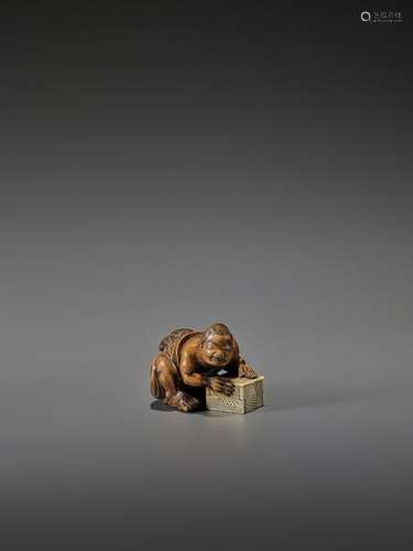 CHIKUSAI: INLAID WOOD NETSUKE OF A RAT CATCHER