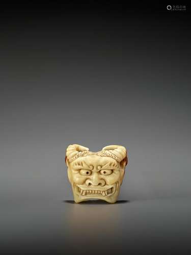 A RARE HORNBILL MASK NETSUKE OF AN ONI