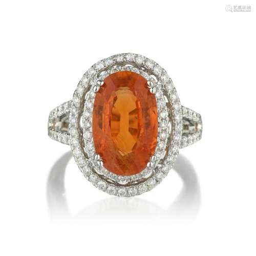 An Orange Sapphire and Diamond Ring