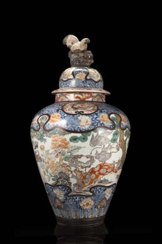 A large polychrome enamel vase and cover decorated with mythical creatures, the cover with a