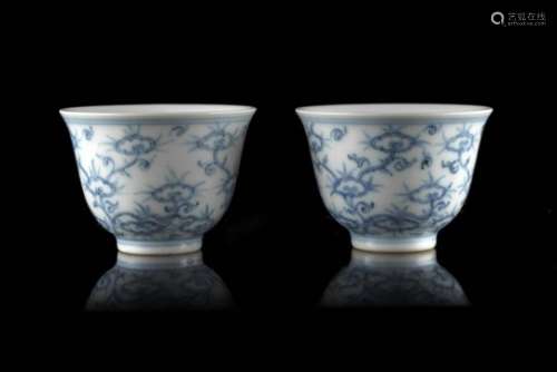 A pair of Ming-style blue and white cups decorated with branches and lingzhi fungus, apocryphal