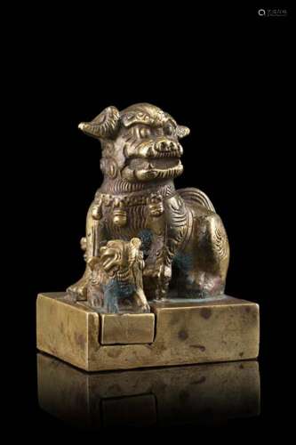 A bronze square seal, surmounted by a Buddhist lion surrounded by two detachable lion cubs, the base