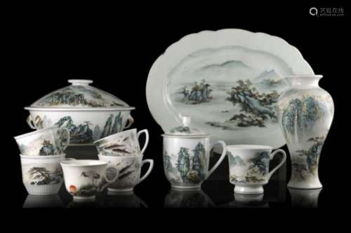 A porcelain table service composed by a tray, a tureen and cover, cups and a small vase decorated