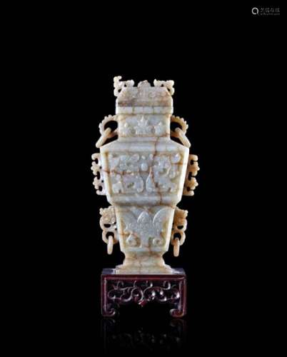 A jade vase decorated with archaistic motifs, wood base (defects and losses)China, late XIX/early XX