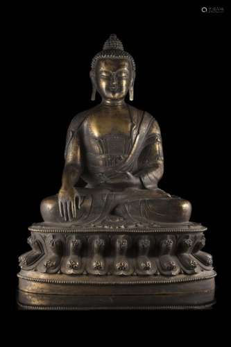 A gilt bronze Buddha, portrayed seated on a double lotus baseChina, late XIX/early XX century(h.