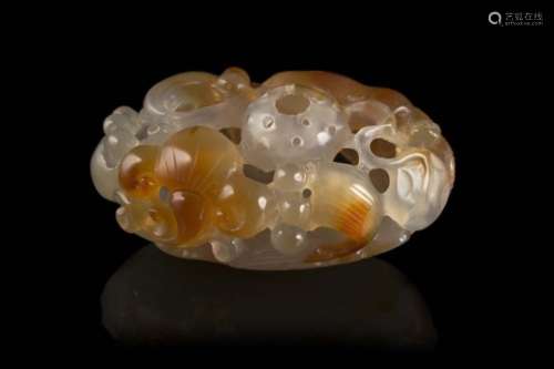 An agate carved and pierced model of a lotus flowersChina, 20th century(l. max 8.5 cm.)ITIntaglio in