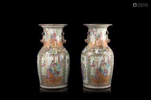 A pair of Cantonese Famille Rose vases decorated with figures in interior scenes (defects)China,