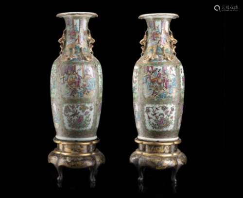 A pair of Cantonese Famille Rose vase of baluster form, lacquered wood bases (defects and losses)