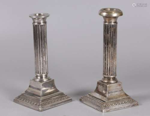 2 silver candleholders