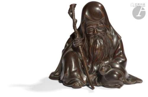 JAPON - XIXe siècle Statuette en bronze à patine brune de l'une des sept divinités du bonheur,
