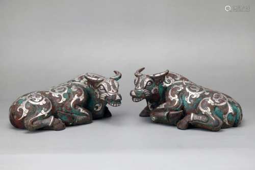 PAIR OF SILVER INLAID AND PAINTED CROUCHING OXEN