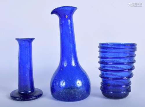 THREE CENTRAL ASIAN BLUE GLASSES. Largest 20 cm high.