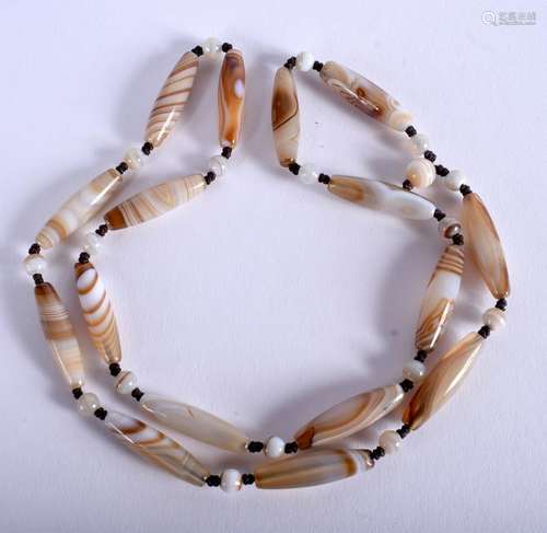 A CENTRAL ASIAN AGATE NECKLACE. 62 cm long.