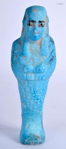 AN EGYPTIAN FAIENCE USHABTI. 14.5 cm high.