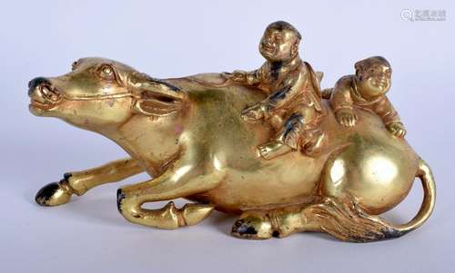 A CHINESE GILT BRONZE FIGURE OF A BUFFALO. 17 cm wide.