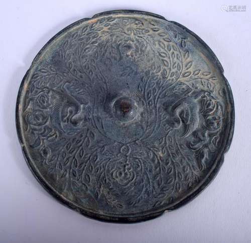 A CHINESE BRONZE HAND MIRROR. 13 cm wide.