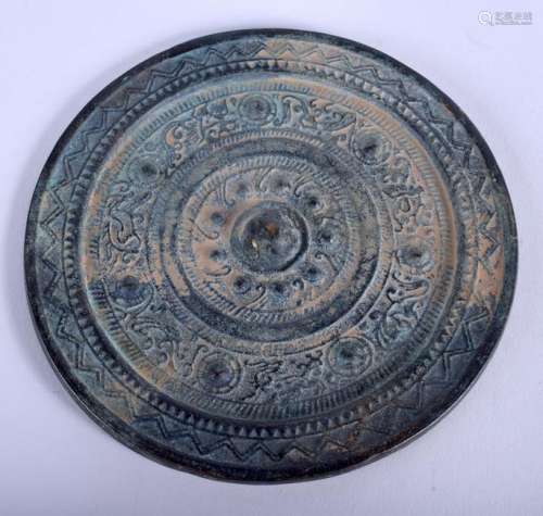 A CHINESE BRONZE HAND MIRROR. 13 cm wide.