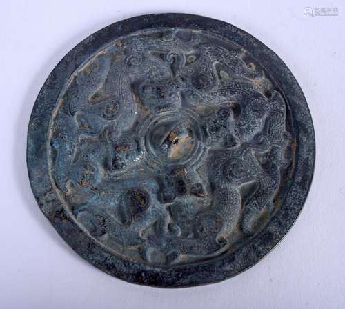 A CHINESE BRONZE HAND MIRROR. 13 cm wide.