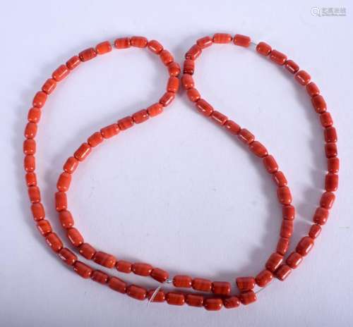 AN EASTERN RED BEAD NECKLACE. 74 cm long.