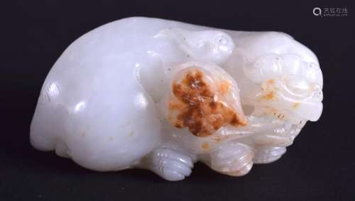A 19TH CENTURY CHINESE CARVED WHITE JADE FIGURE OF A