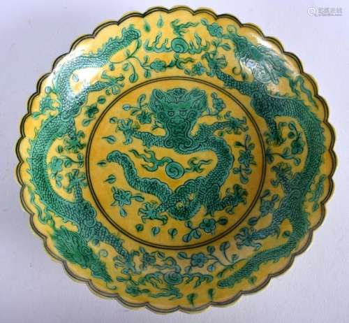 A CHINESE FAMILLE VERTE DRAGON DISH.