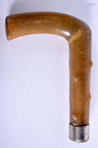 A 19TH CENTURY HORN WALKING CANE HANDLE. 9 cm x 13 cm.