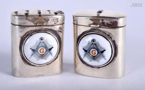 A PAIR OF SILVER MASONIC CONDIMENTS. 2.5 cm high. (2)