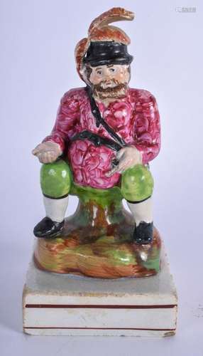 AN EARLY 19TH CENTURY PEARLWARE FIGURINE IN THE FORM OF