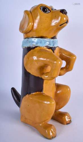 A 1930'S FAIENCE POTTERY FIGURE OF A BEGGING DOG,