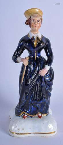 A 19TH CENTURY STAFFORDSHIRE POTTERY FIGURINE OF QUEEN