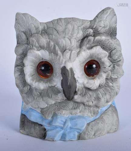 AN EARLY 20TH CENTURY BISQUE POTTERY OWL HEAD VASE,