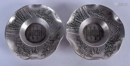 A PAIR OF CHINESE SILVERED BRONZE DISHES. 10 cm wide.