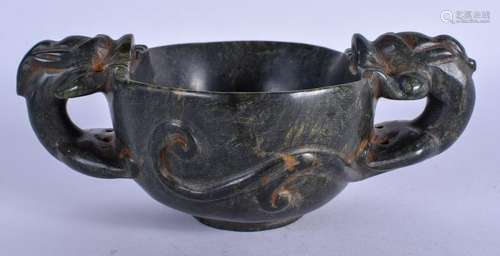 A CHINESE STONE LIBATION CUP. 18 cm wide.