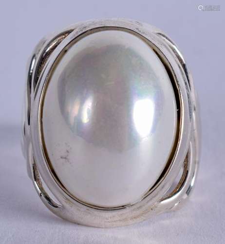 A SILVER RING. Q.