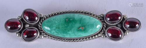 A VINTAGE SILVER JADEITE AND GARNET BROOCH. 7 cm wide.