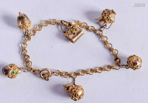 A 1920S SILVER GILT ENAMELLED CHARM BRACELET. 18 cm